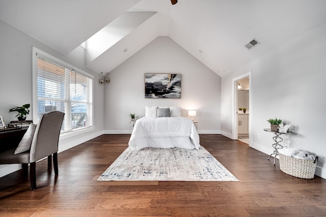 bedroom with ceiling fan, dark hardwood / wood-style flooring, high vaulted ceiling, and ensuite bath