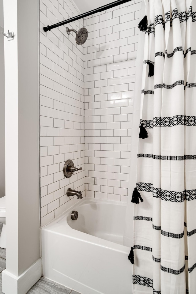 bathroom featuring shower / bath combo with shower curtain