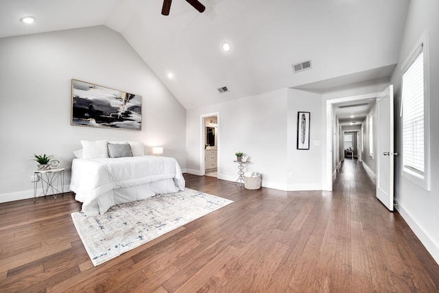 bedroom featuring ceiling fan, dark hardwood / wood-style flooring, and vaulted ceiling