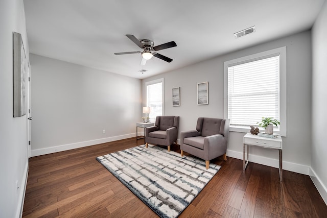 sitting room featuring ceiling fan and dark hardwood / wood-style flooring