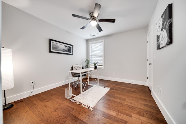 home office with ceiling fan and dark wood-type flooring