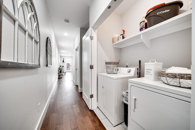 laundry room with dark hardwood / wood-style flooring and independent washer and dryer