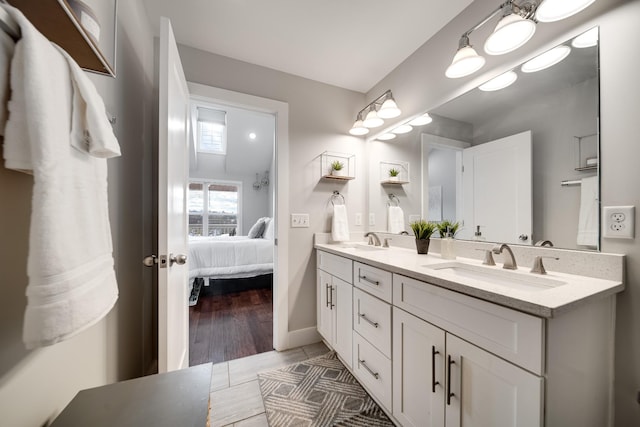 bathroom with vanity and hardwood / wood-style flooring