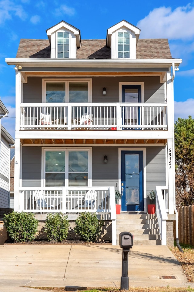 view of front of property with a balcony