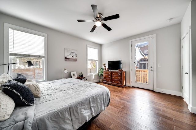 bedroom featuring access to exterior, ceiling fan, and hardwood / wood-style flooring