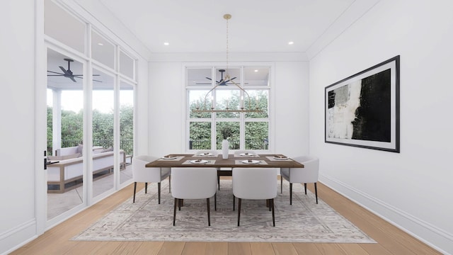 dining space with a chandelier and light hardwood / wood-style flooring