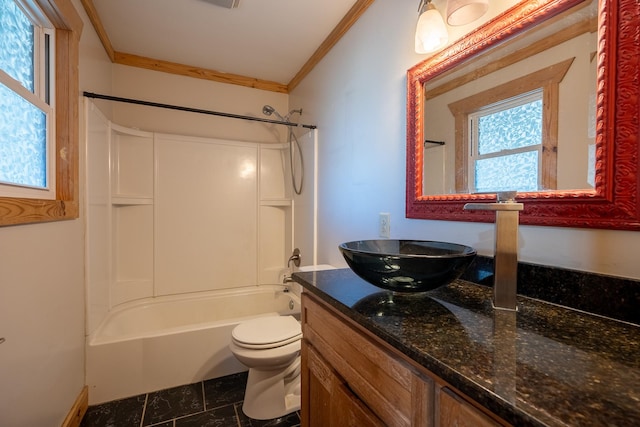 full bathroom with vanity, crown molding, tub / shower combination, and toilet