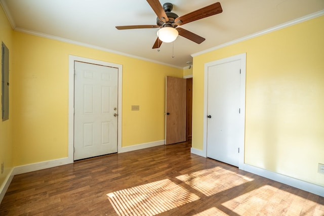 unfurnished bedroom with ceiling fan, ornamental molding, and wood-type flooring