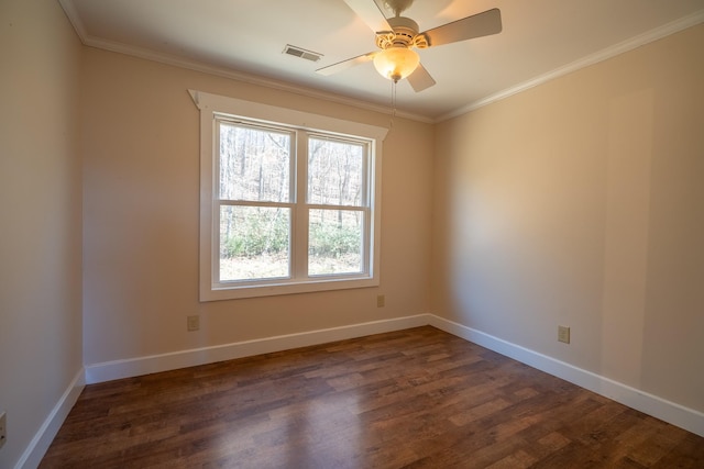 spare room with dark hardwood / wood-style flooring, crown molding, and ceiling fan