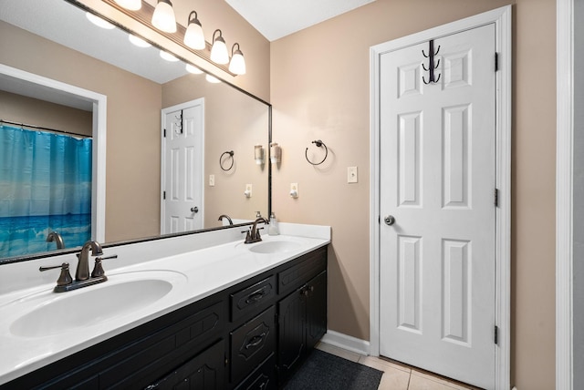 bathroom with vanity and tile patterned floors