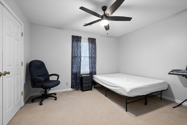 bedroom featuring ceiling fan and light colored carpet