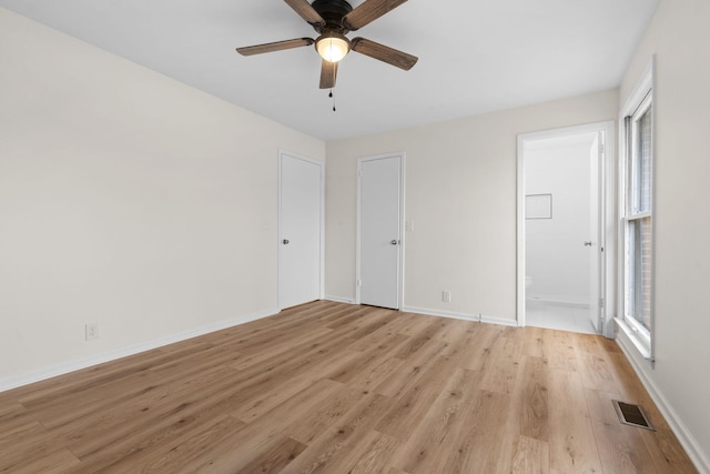 unfurnished bedroom with ensuite bath, ceiling fan, and light hardwood / wood-style flooring