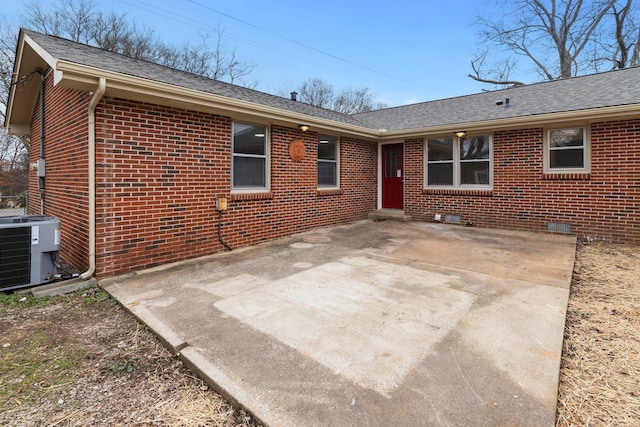 rear view of property with a patio area and central air condition unit