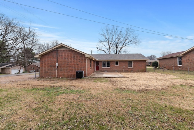 back of house with a lawn, a patio area, and central AC unit