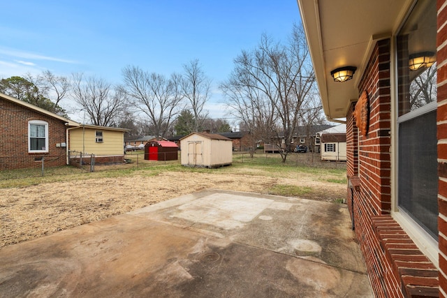 view of patio featuring a shed