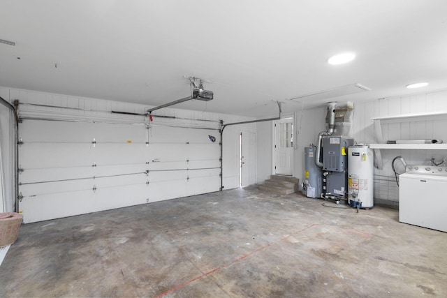 garage featuring washer / dryer, a garage door opener, and water heater