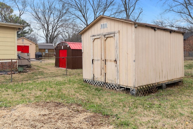 view of outbuilding with a lawn