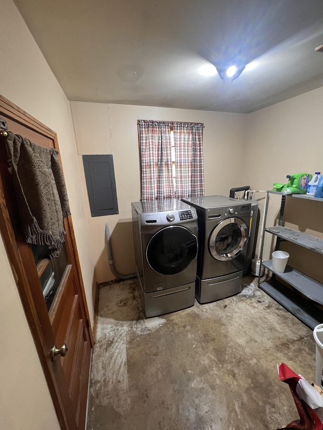 laundry area with washing machine and dryer and electric panel