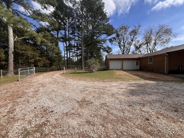 view of yard featuring a garage