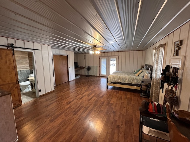 619 N Diagonal St, Decherd, TN 37324 - bedroom featuring wood finished floors and a barn door