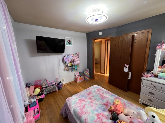 bedroom with wood-type flooring