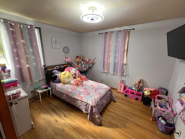 bedroom with light hardwood / wood-style floors