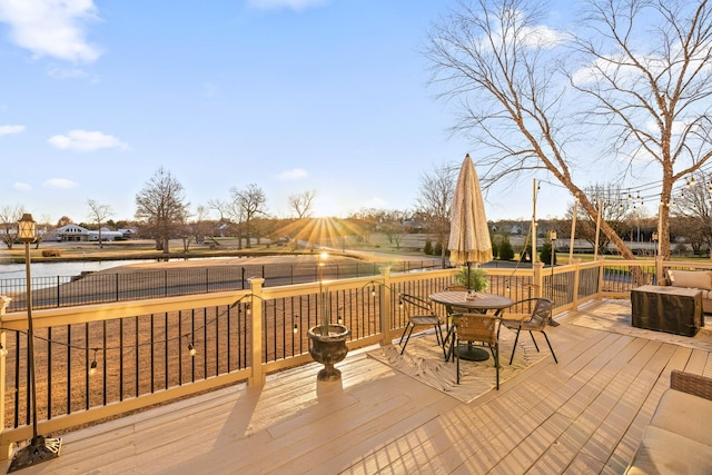 wooden deck with a water view