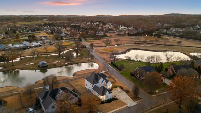 aerial view at dusk with a water view