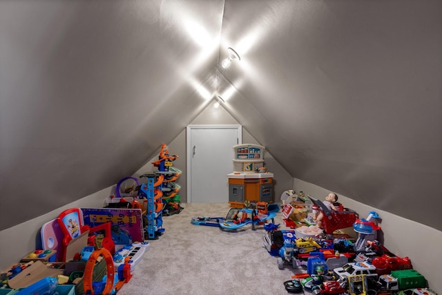 game room featuring carpet and lofted ceiling