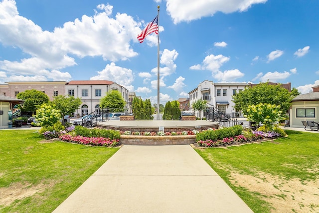 view of property's community with a yard