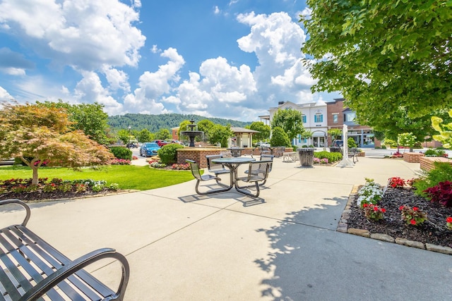 view of patio / terrace featuring a mountain view