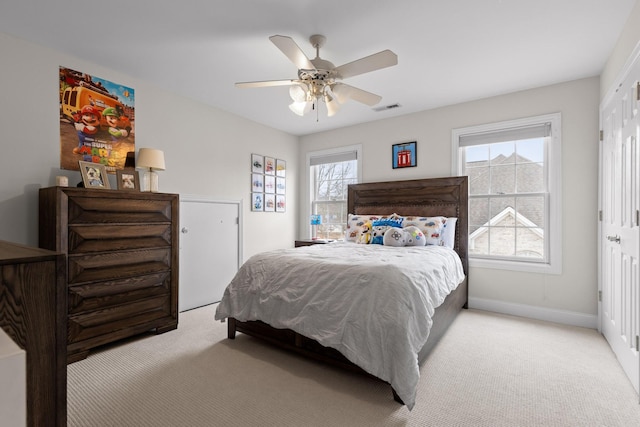 carpeted bedroom featuring ceiling fan