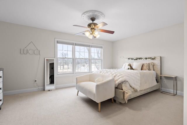 bedroom with light colored carpet and ceiling fan