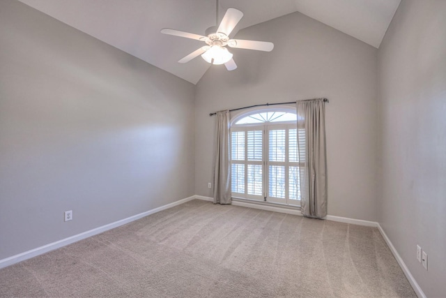 spare room with ceiling fan, carpet floors, and high vaulted ceiling