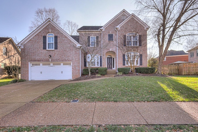 view of front property featuring a front lawn and a garage