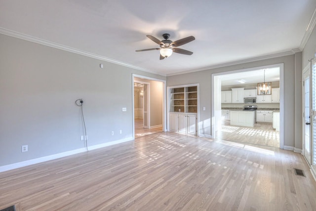 unfurnished living room featuring built in features, light hardwood / wood-style floors, ceiling fan with notable chandelier, and ornamental molding