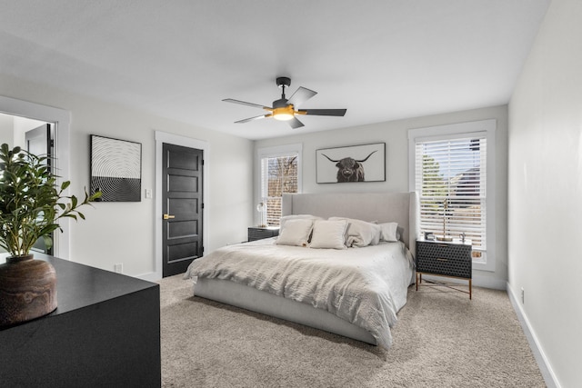 carpeted bedroom featuring ceiling fan