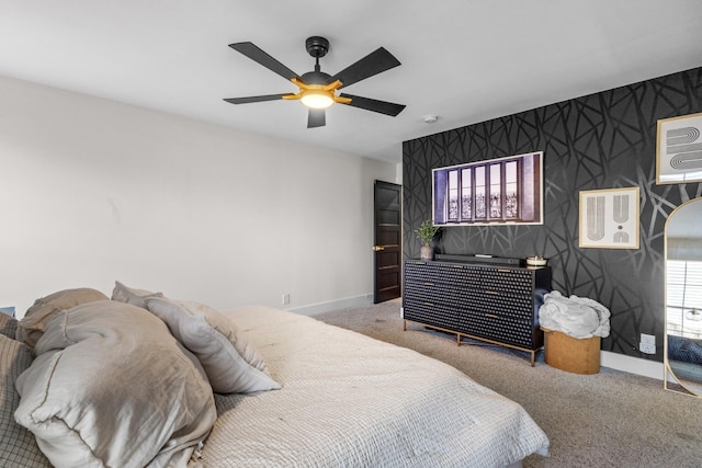 carpeted bedroom featuring multiple windows and ceiling fan