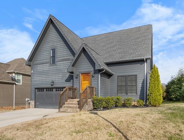 view of property with a front yard and a garage