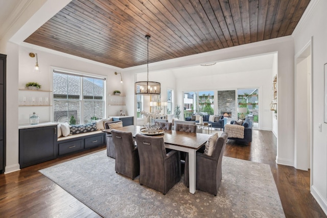 dining room featuring a wealth of natural light and wooden ceiling