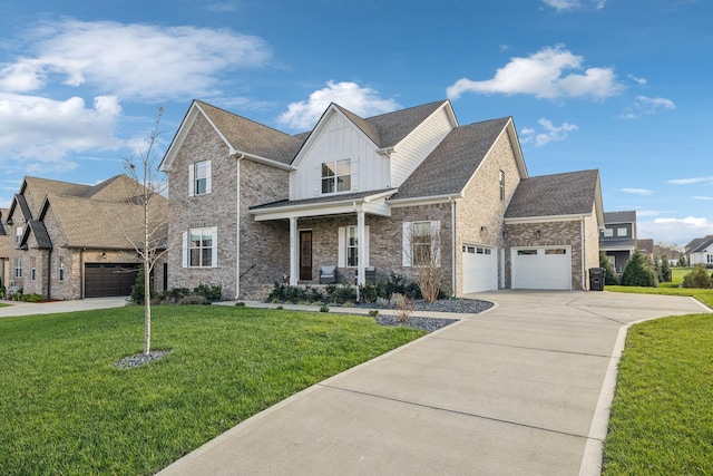 view of front of house featuring covered porch, a garage, and a front yard