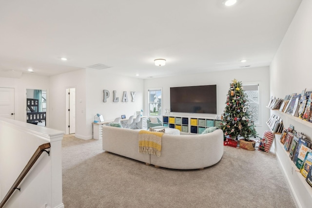 living room featuring light carpet