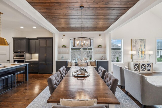 dining room with dark hardwood / wood-style floors, an inviting chandelier, crown molding, and wood ceiling