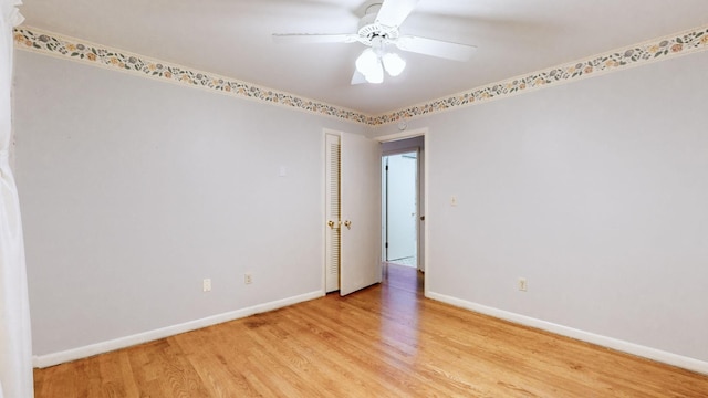 spare room with ceiling fan and light hardwood / wood-style floors