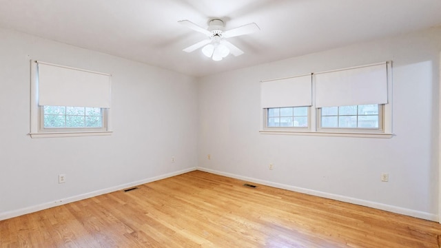 unfurnished room with ceiling fan and light hardwood / wood-style floors