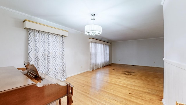 interior space with crown molding and light hardwood / wood-style flooring