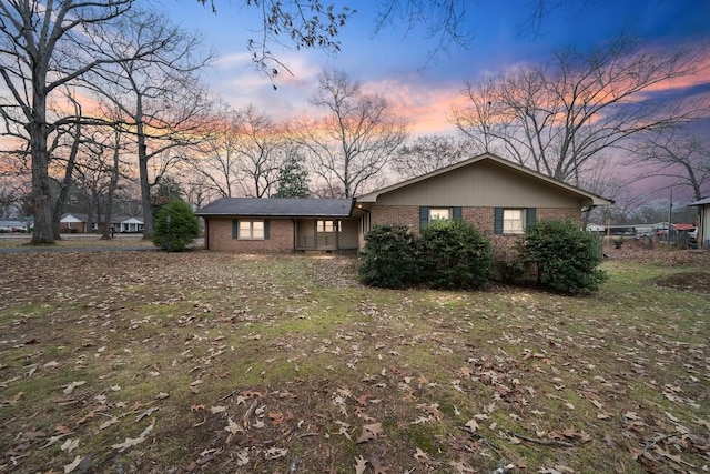 ranch-style house with a lawn