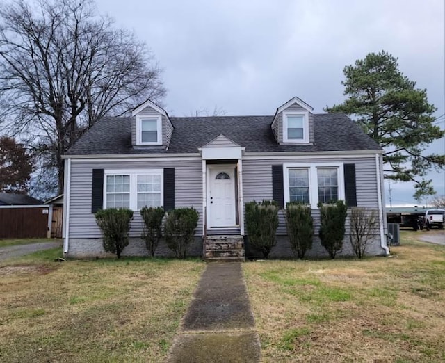 new england style home with a front yard