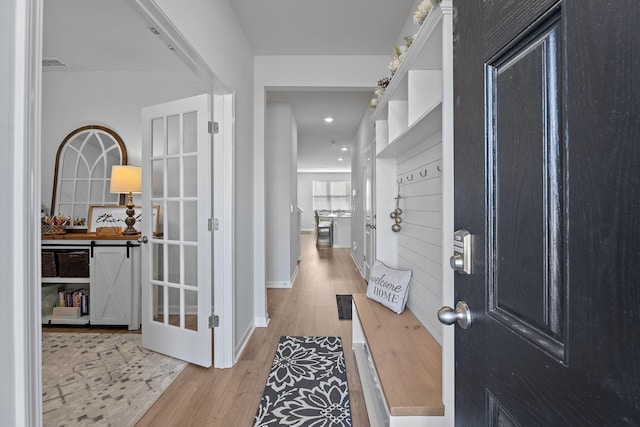 hallway with wood-type flooring