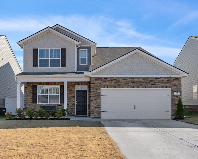 craftsman-style home with a garage and a front yard